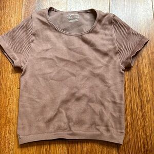 This is a XS-S top very stretchy could probably fit a medium brought from Pacsun